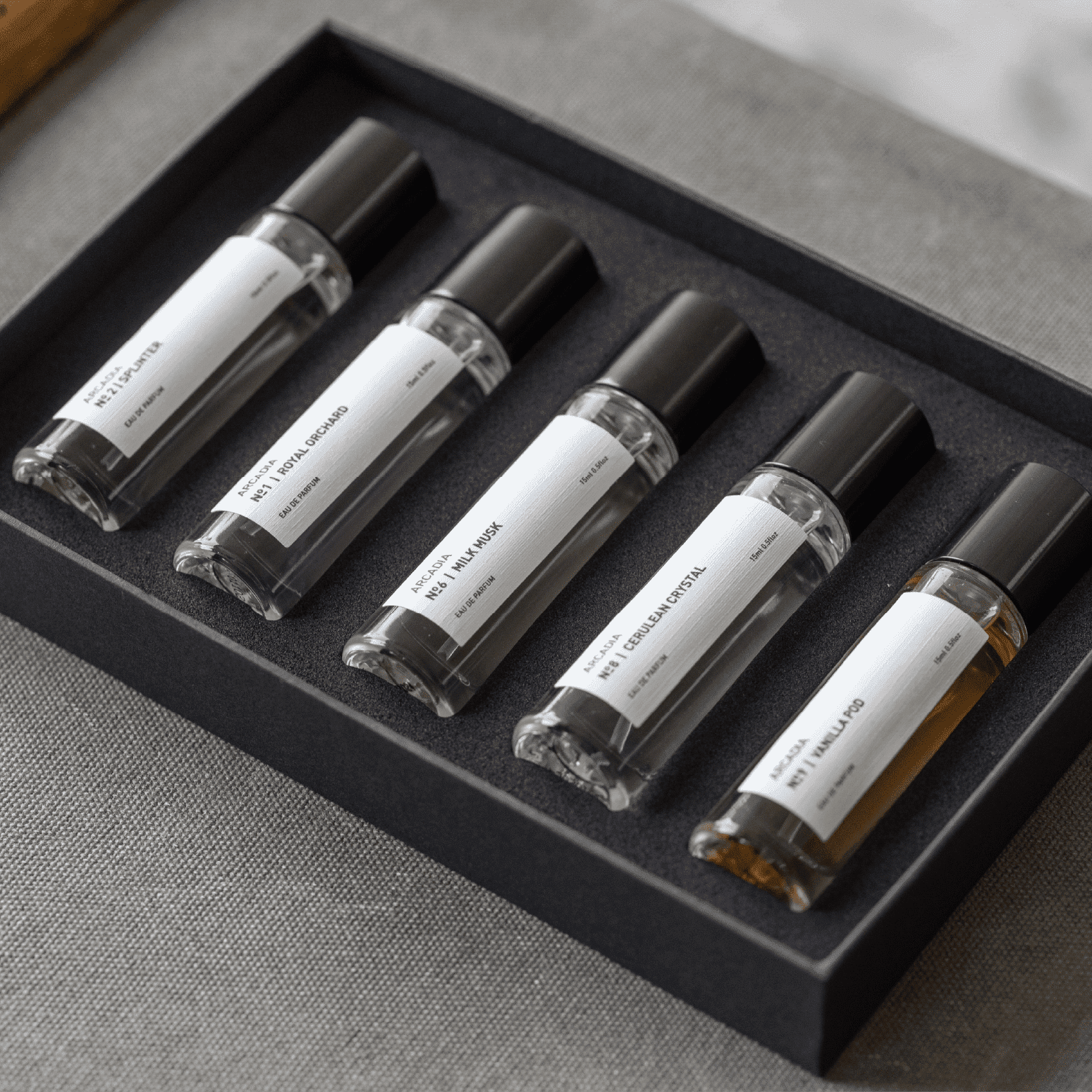 Dubai, UAE, Shopiva Arcadia perfume discovery set five minimalist fragrance vials displayed in a black gift box