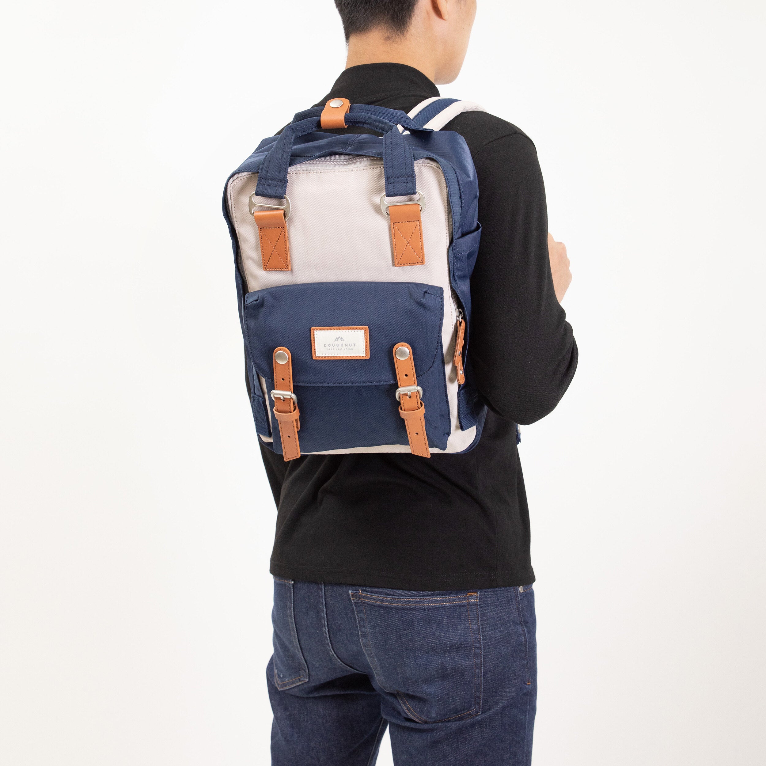 Dubai, UAE, Shopiva Doughnut Macaroon unisex backpack in ivory and navy